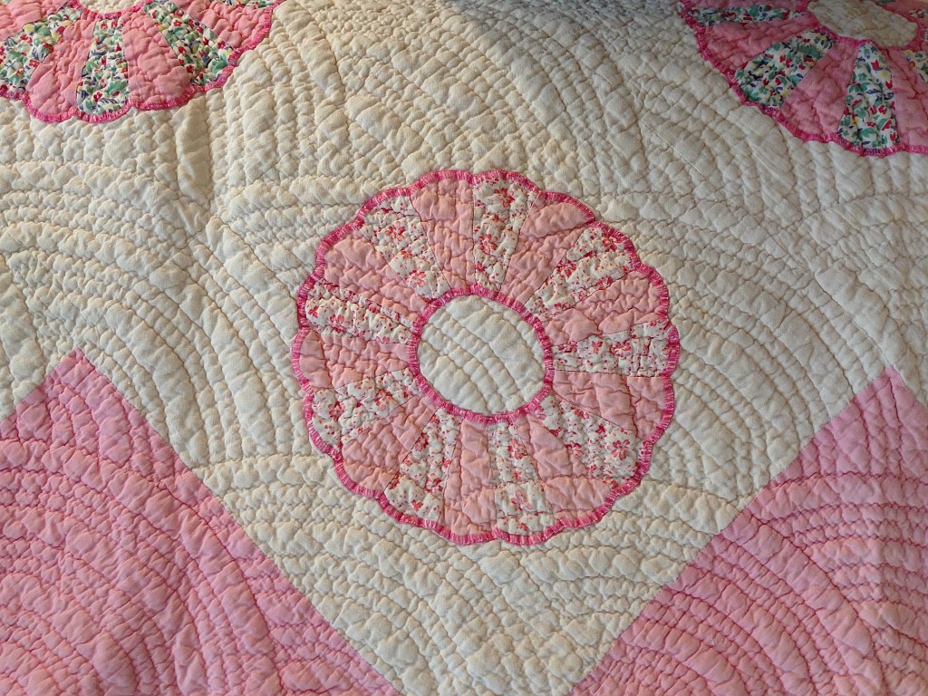 a pink quilt that was on my bed as a child made by Nannie